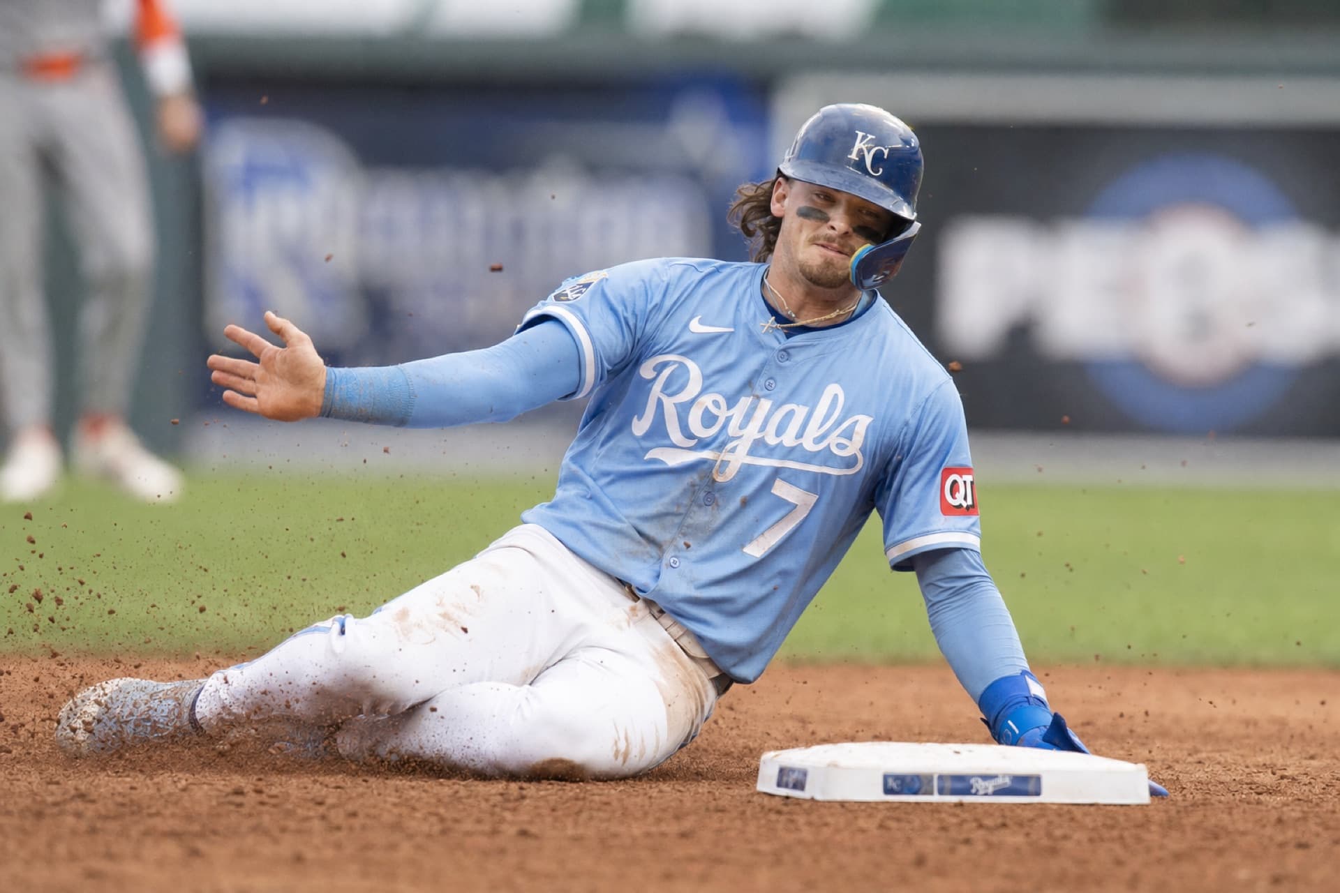 Bobby Witt Jr. sliding into a base during an MLB game